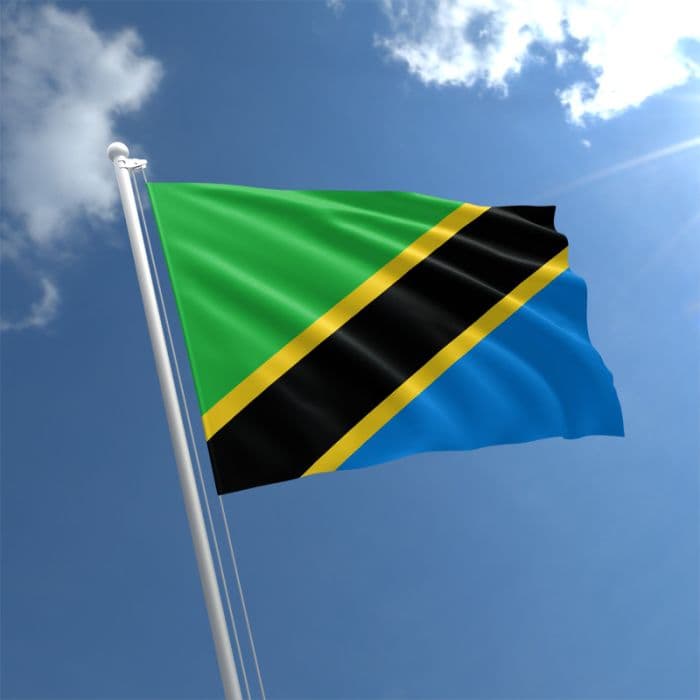 The flag of Tanzania against a blue sky